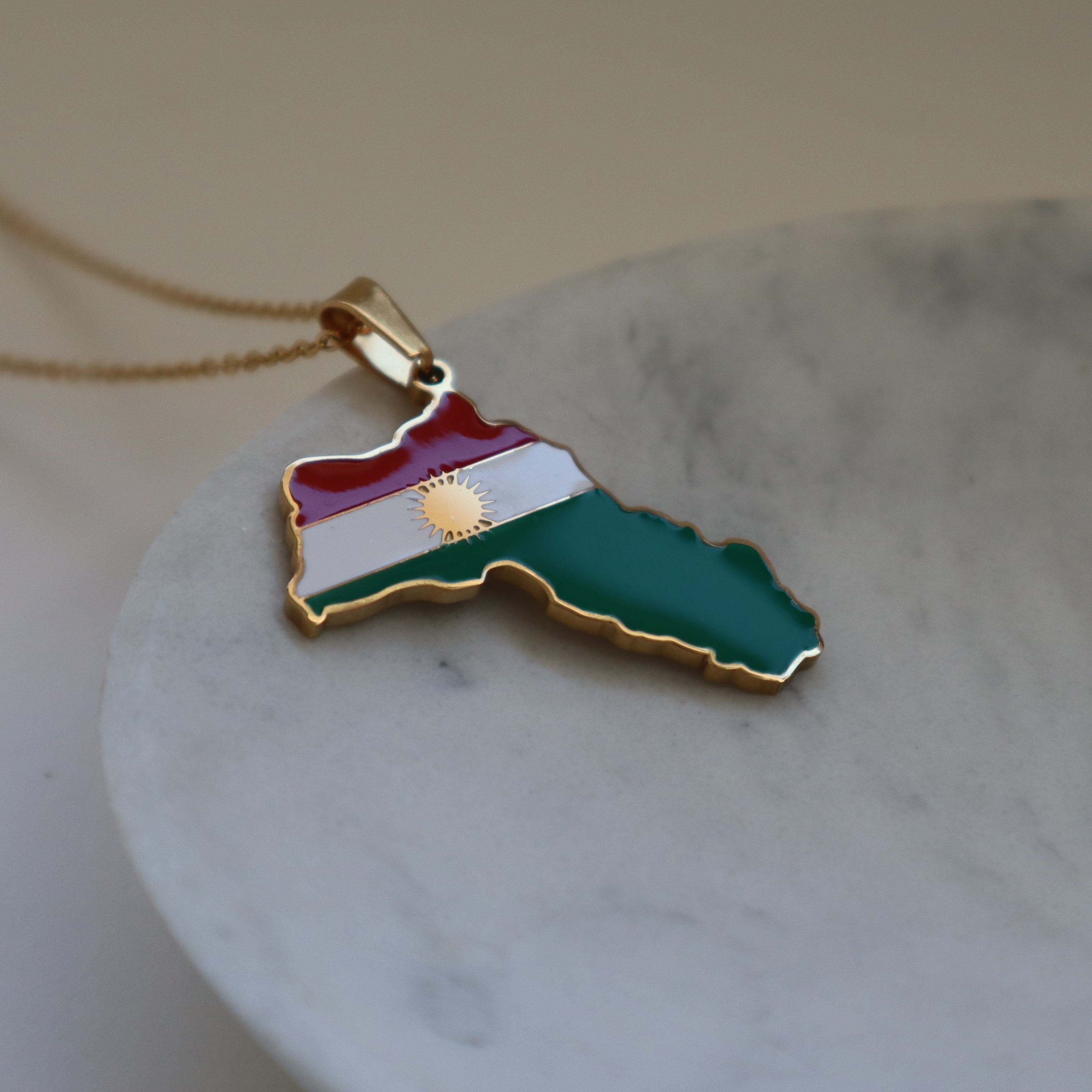 https://parisalondon.co.uk/cdn/shop/files/Kurdistan-gold-flag-necklace-2.jpg?v=1685755377